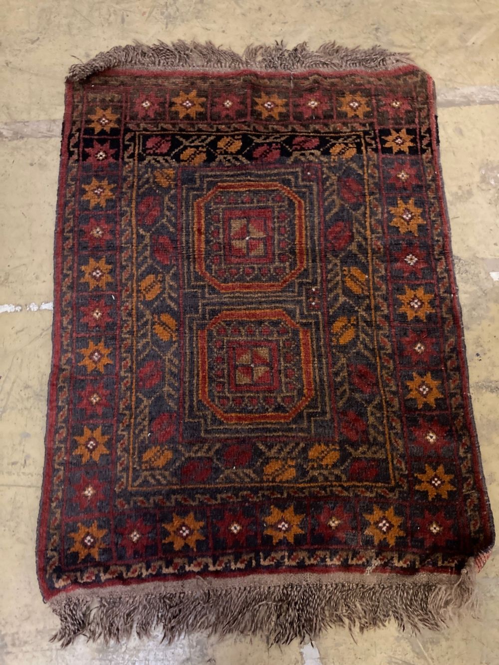 A Bokhara rug and a Turkish geometric rug, larger 150 x 100cm